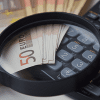 Examining_Costs_&_Savings_Money_On_Calculator