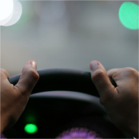 Hands_Clutching_Steering_Wheel